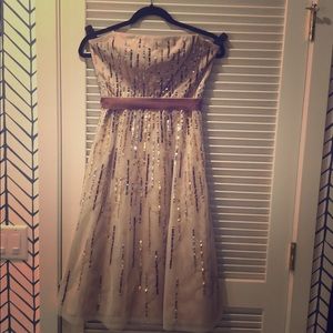 Strapless nude sequins dress.